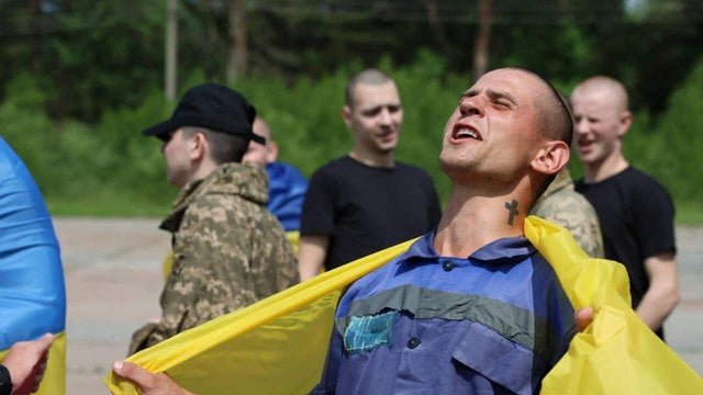 Ukrainian POWs are seen after a swap at an unknown location in Ukraine 